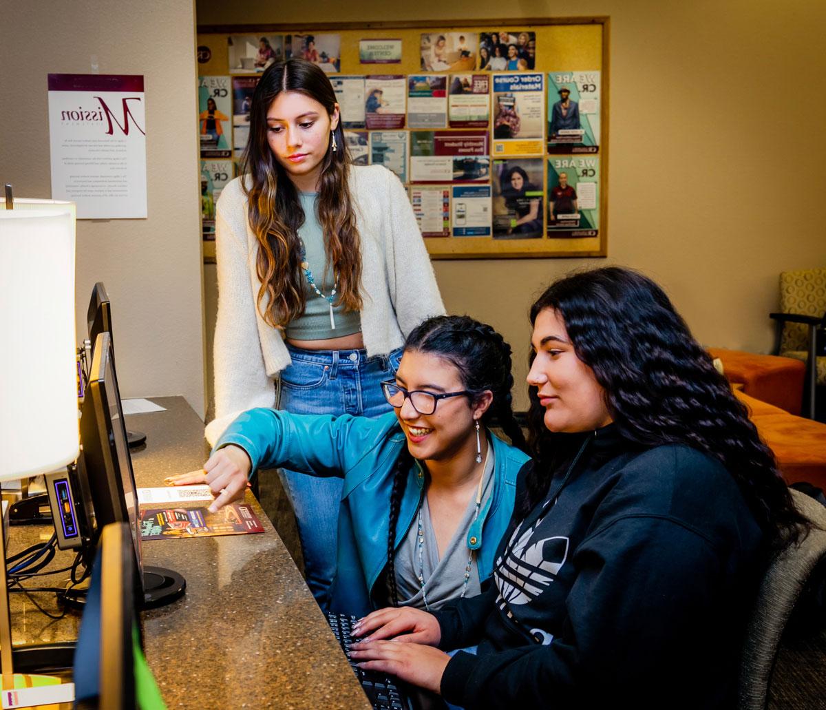 3 students working at a computer